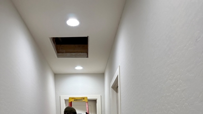 The hallway access opening photo showing the reality of attic replacements. Photo