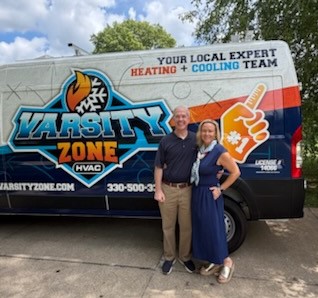 Tom and his wife Jen in front of Varsity Zone HVAC van